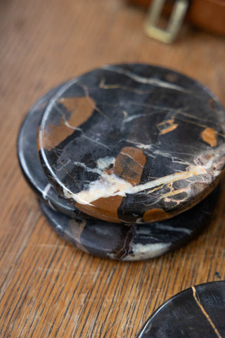 Close-up of the Set of 4 Black Marble Coasters stacked together.