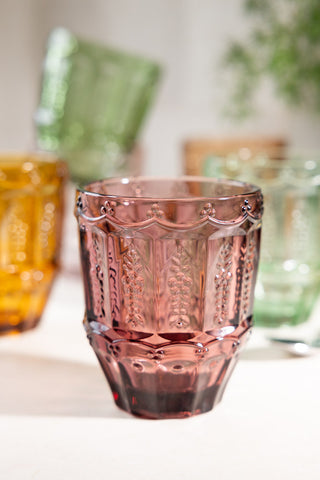 Close-up of one of the Set of 6 Colourful Vintage-Style Glass Tumblers, styled with the others in the background.