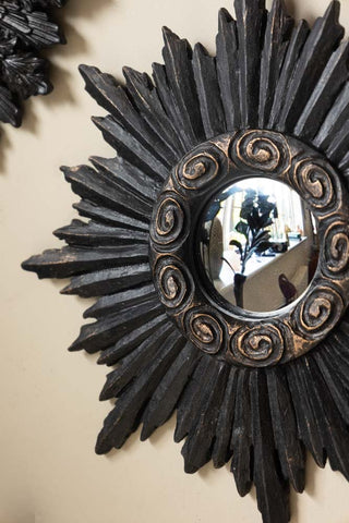 Close-up of one of the Set of 9 Ornate Antique Black Framed Mirrors.