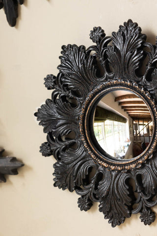 One of the Set of 9 Ornate Antique Black Framed Mirrors on a neutral wall.