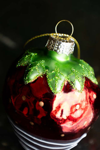 Detail of the top of the strawberry christmas decoration.