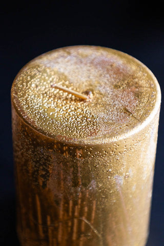 Detail shot of the top of the Shiny Gold Pillar Candle - Short.