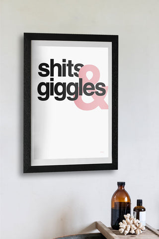 The Shits & Giggles Art Print - Unframed displayed in a frame on a white wall above a bath, styled with a bath tray.