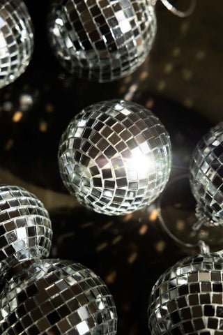 A detailed image of one of the Silver Disco Balls with sunlight catching the mirrors