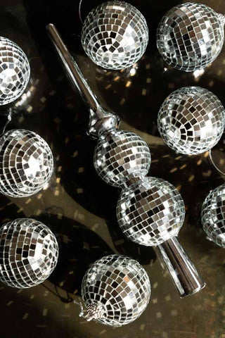 An image of the full set of Silver Disco Ball Tree Topper with sunlight catching the mirrors