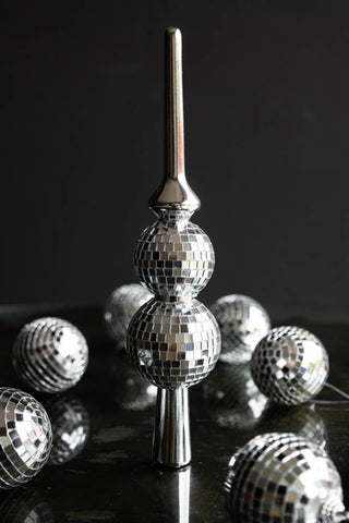 A Silver Disco Ball Tree Topper styled with various silver disco ball Christmas tree decorations.