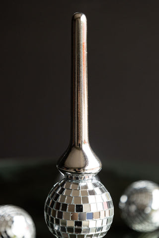 Close-up of the top of the Silver Disco Ball tree topper.