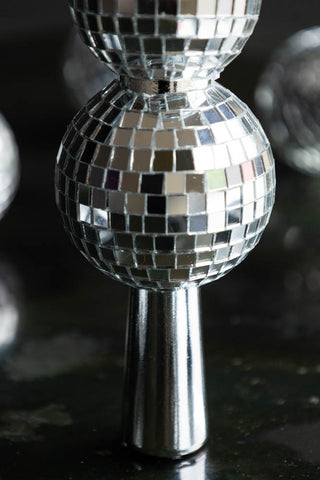 Close-up of the base of the Silver Disco Ball Tree Topper.