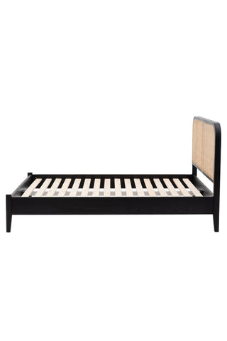 Cutout of the Sleek Curved Wooden Bedframe seen from the side.