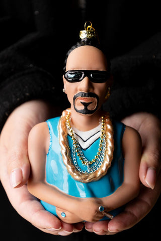 The Snoop Inspired Christmas Tree Decoration being held in a model's hands.