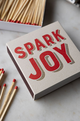 The Spark Joy Luxury Matches with the box/sleeve separated and some of the matches out of the box.