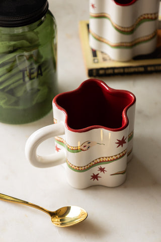 Star Shaped Mug with Snake Print Detail on white marble with gold spoon and tin of tea