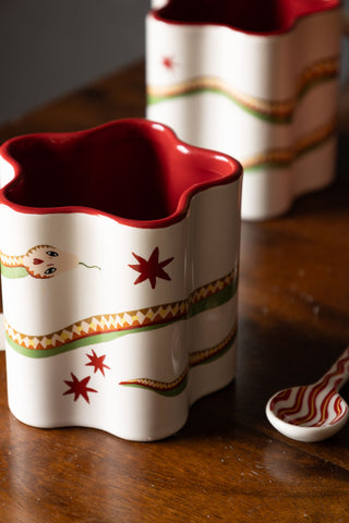 Close-up of the Star Shaped Mug with Snake Print Detail with another in the background.