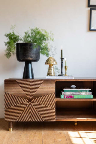 The Starburst TV Unit styled with books, magazines and various decorative accessories.