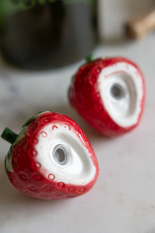 Detail shot of the bases of the Strawberry Salt & Pepper Shakers.