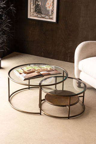 Sunrise Nest Of 2 Tables in a living room setting against a brown wall