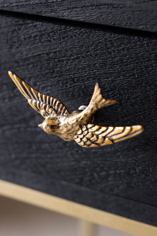 The Swallow Bird Knob - Gold on a drawer.