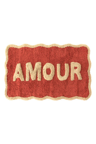 Cutout of the Terracotta Amour Bath Mat on a white background.