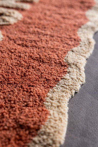 Detail shot of the edge of the Terracotta Amour Bath Mat.