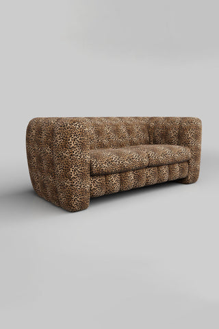 The Bowie Large Sofa In Leopard Love Velvet Natural on a plain background, seen from a side angle.