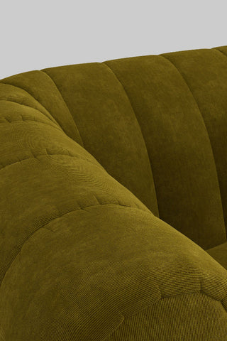 Close-up of the fabric of the The Bowie Love Seat In Luxe Kneedlecord Velvet Vintage Green.