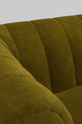 Close-up of the fabric of The Bowie Large Sofa In Luxe Kneedlecord Velvet Vintage Green.