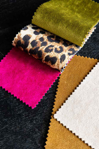 A Lifestyle Image of The Bowie Sofa Range Fabric Swatch - a selection of the 5 colours available