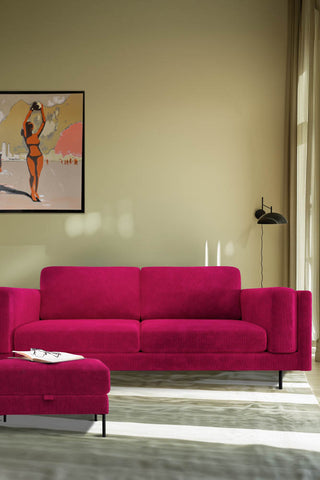 The Grace Large Sofa In Luxe Kneedlecord Velvet Harry's Pink styled in a living room with a footstool.