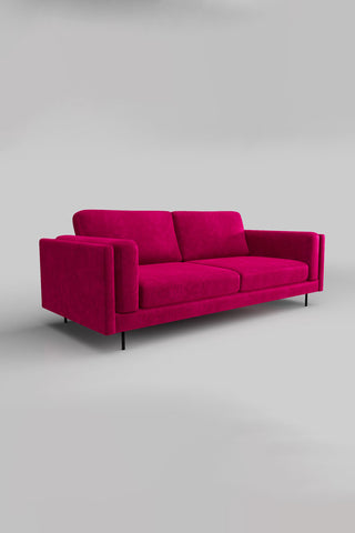 The Grace Large Sofa In Luxe Kneedlecord Velvet Harry's Pink on a plain background, seen from a side angle.