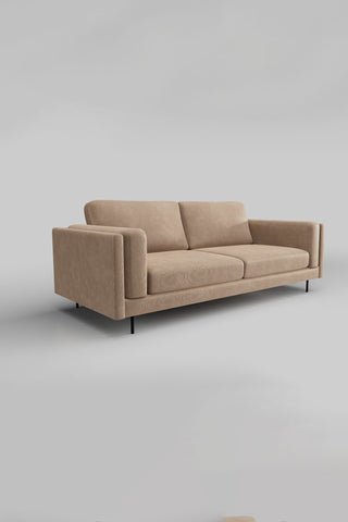 The Grace Large Sofa In Luxe Kneedlecord Velvet Natural Whisper on a plain background, seen from a side angle.