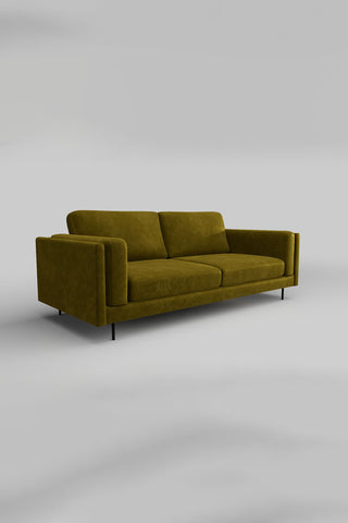The Grace Large Sofa In Luxe Kneedlecord Velvet Vintage Green on a plain background, seen from a side angle.