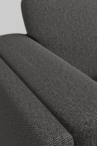 Close-up of the fabric/arm of The Grace Large Sofa In Timeless Texture Black Bean.