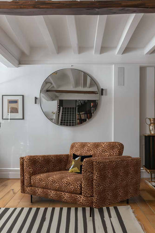 The Grace Love Seat In Leopard Love Velvet Natural styled in a living room, with a cushion on.