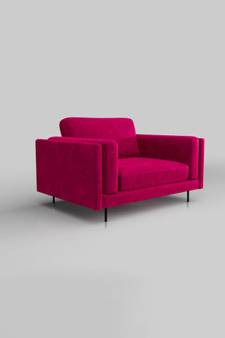 The Grace Love Seat In Luxe Kneedlecord Velvet Harry's Pink on a plain background, seen from a side angle.