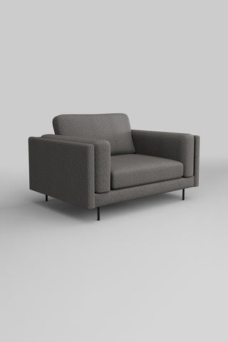 The Grace Love Seat In Timeless Texture Black Bean in front of a plain background, seen from a side angle.