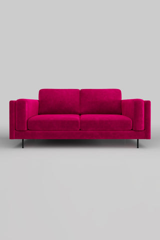 The Grace Medium Sofa In Luxe Kneedlecord Velvet Harrys Pink on a plain background, seen from the front.