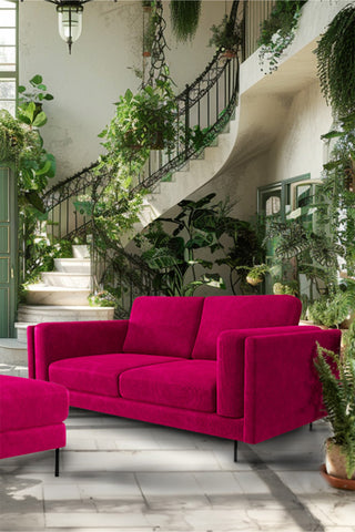 The Grace Medium Sofa In Luxe Kneedlecord Velvet Harry's Pink styled in a living room with a footstool.