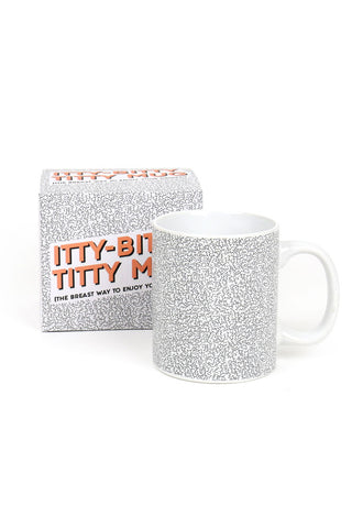 The Itty Bitty Titty Mug and box on a white background.