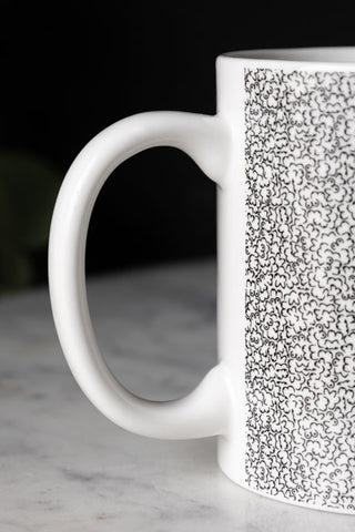 Detail shot of the handle of The Itty Bitty Titty Mug.