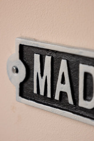 Detail shot of one end of The Madhouse Sign.