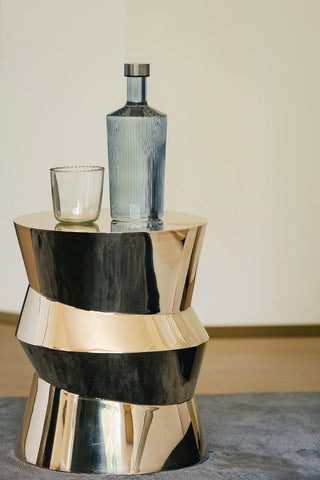 The Paveau - Gorgeous Ribbed Glass Carafe in Grey Blue styled on a side table with a glass.