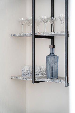 The Paveau - Gorgeous Ribbed Glass Carafe in Grey Blue styled on a shelf with glassware.