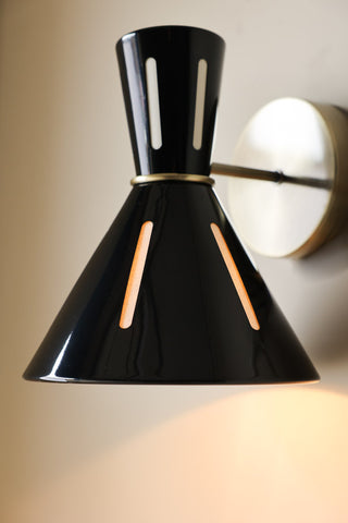 Detailed image of the Tribeca Metal Wall Light illuminated and displayed on a kitchen wall