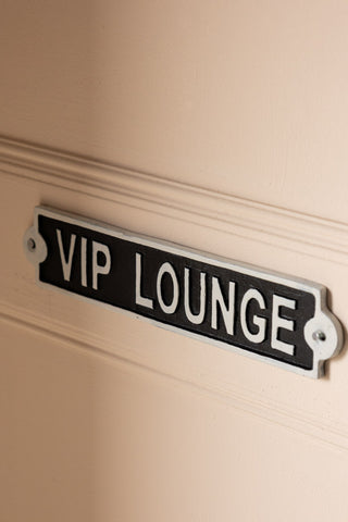 The VIP Lounge Sign displayed on the wall.