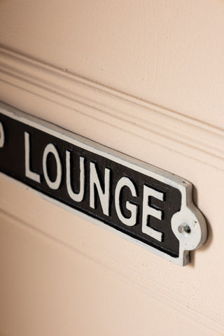 Close-up of one end of the VIP Lounge Sign, displayed on the wall.