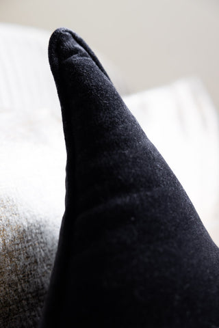 Detail shot of the Velvet Star Cushion In Black.