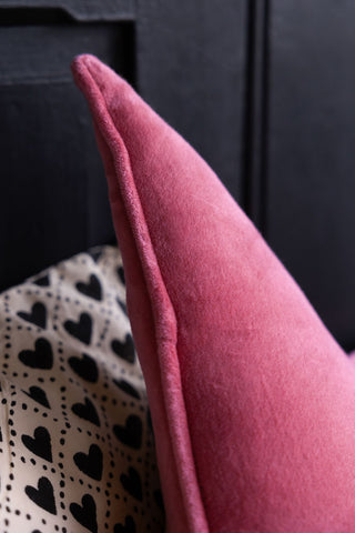 Detail shot of the Velvet Star Cushion In Hot Pink.