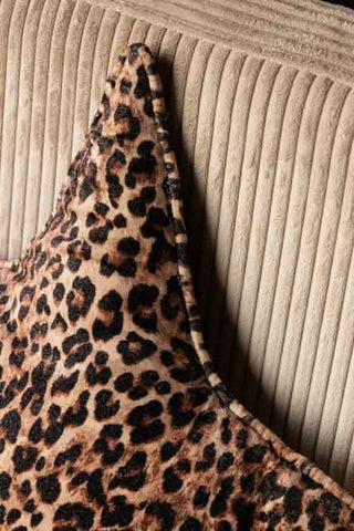 Detail shot of the Velvet Star Cushion In Leopard Print.