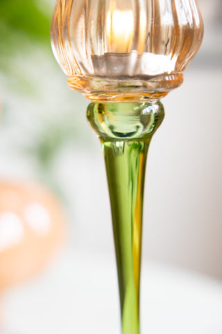 Close-up of the stem of the Vintage-Style Orange Glass Flower Candle Holder.