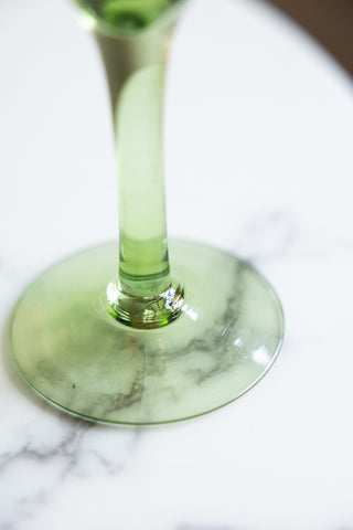 Close-up of the base of the Vintage-Style Yellow Glass Flower Candle Holder.